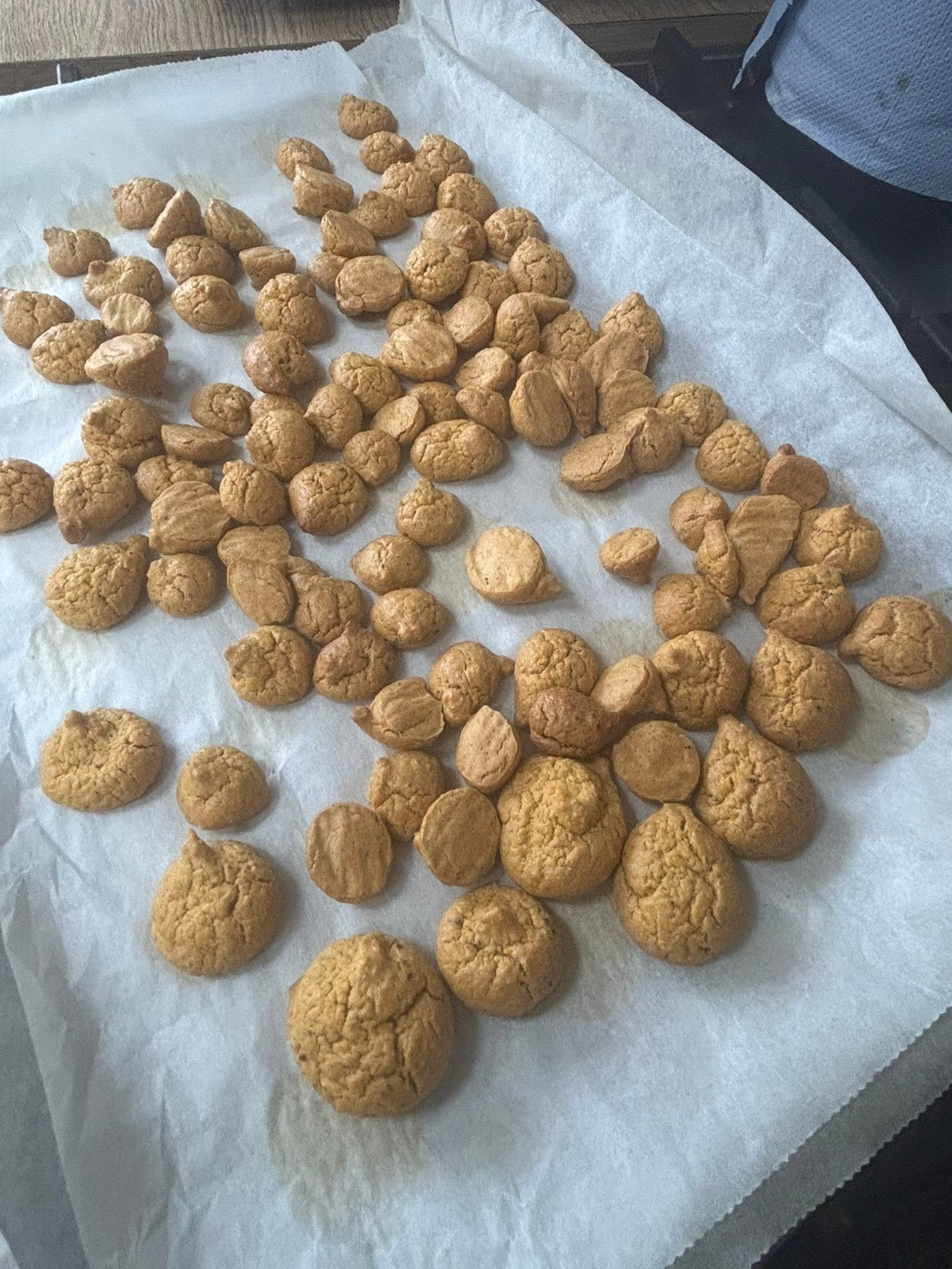 Baked mackerel bites spread over baking parchment