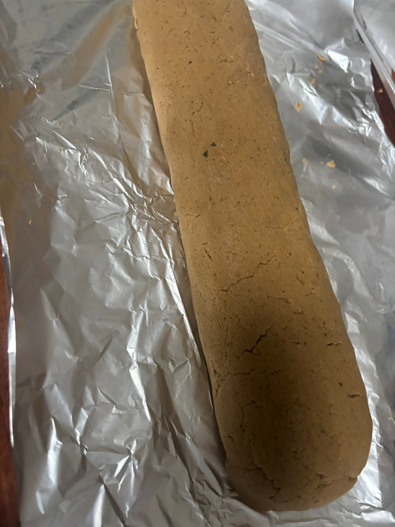 Smooth homemade chub roll unwrapped on foil