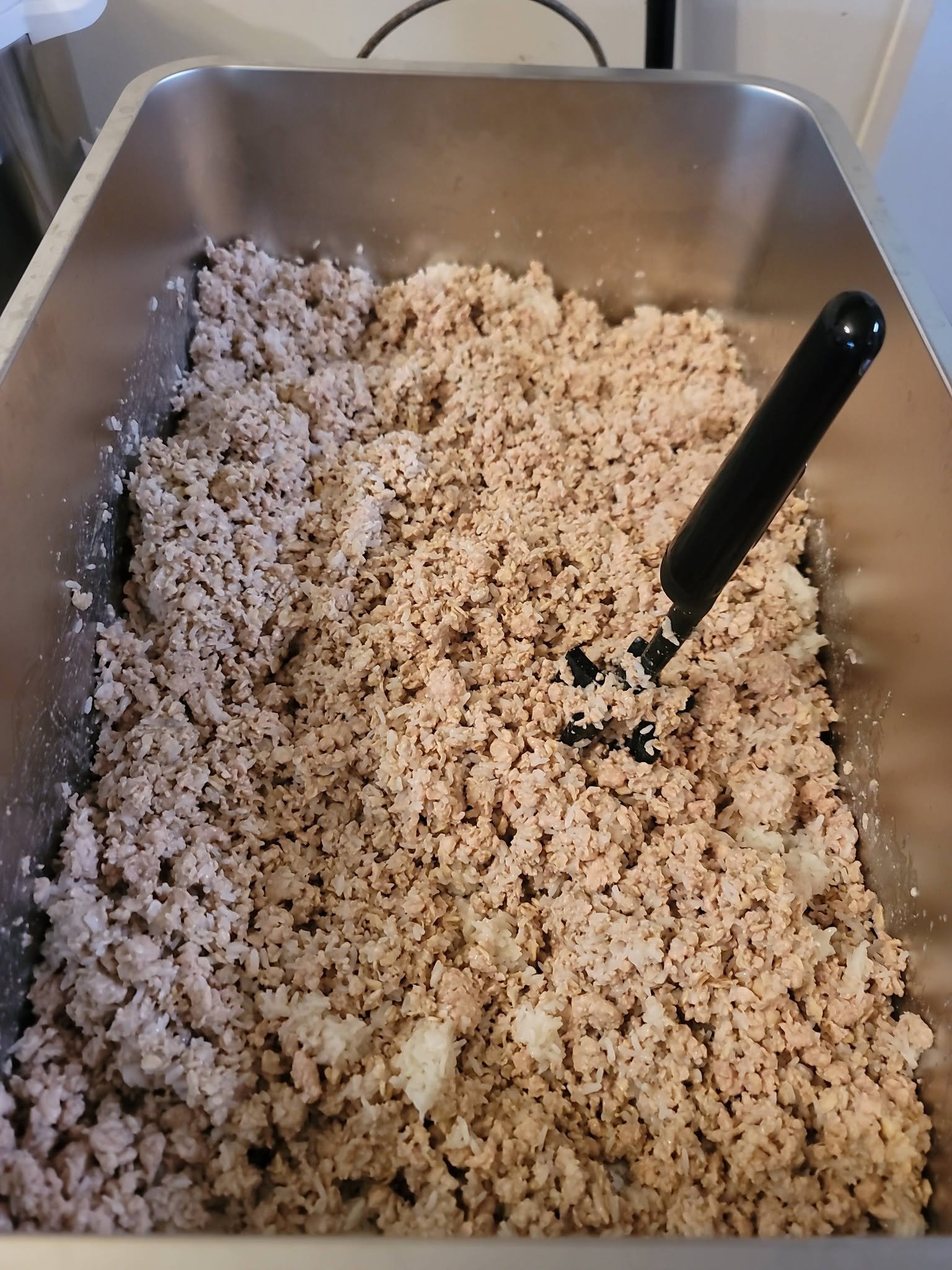 Chicken and grain mixture in a metal pan
