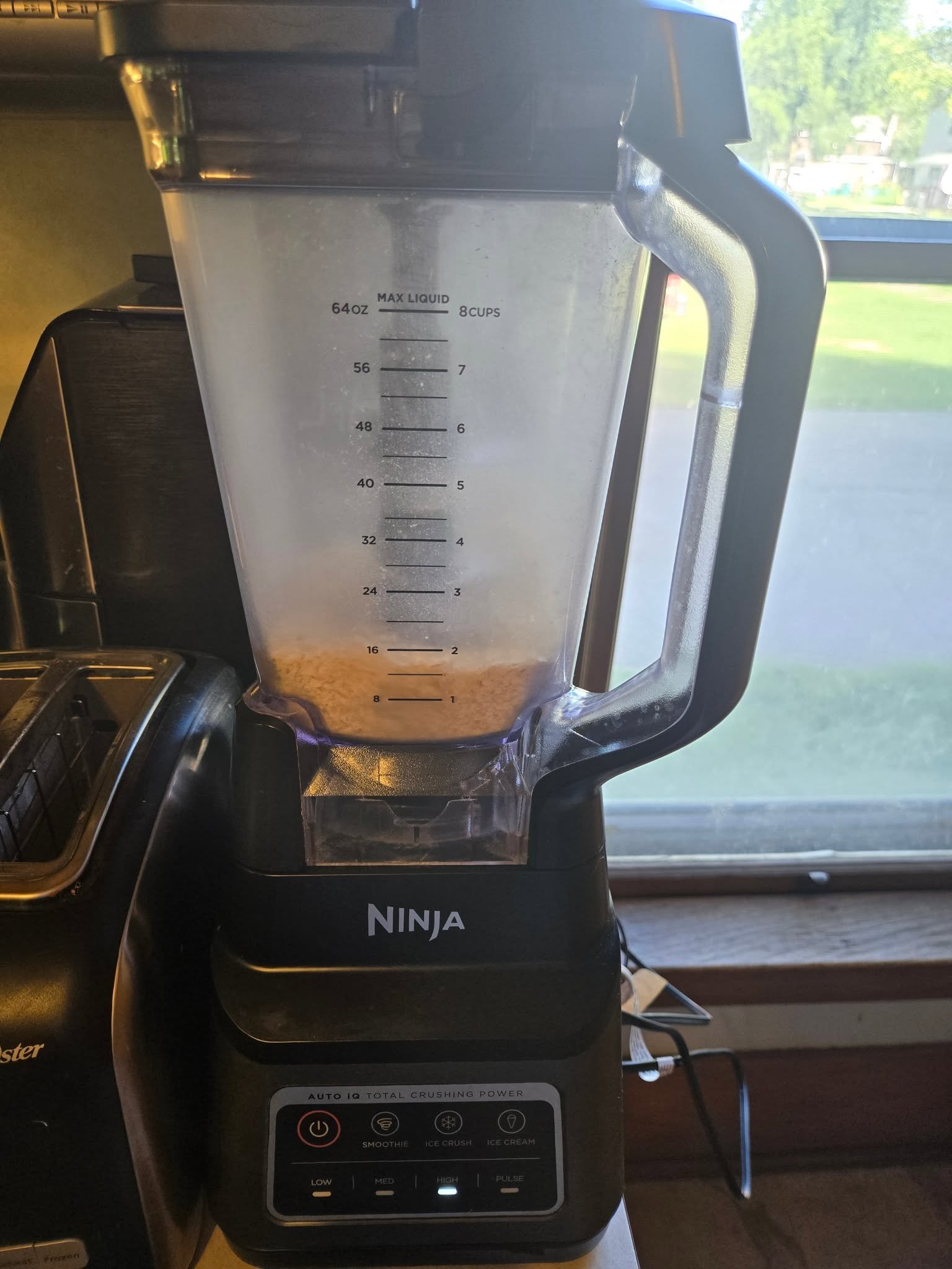 Eggshells being ground in a covered blender