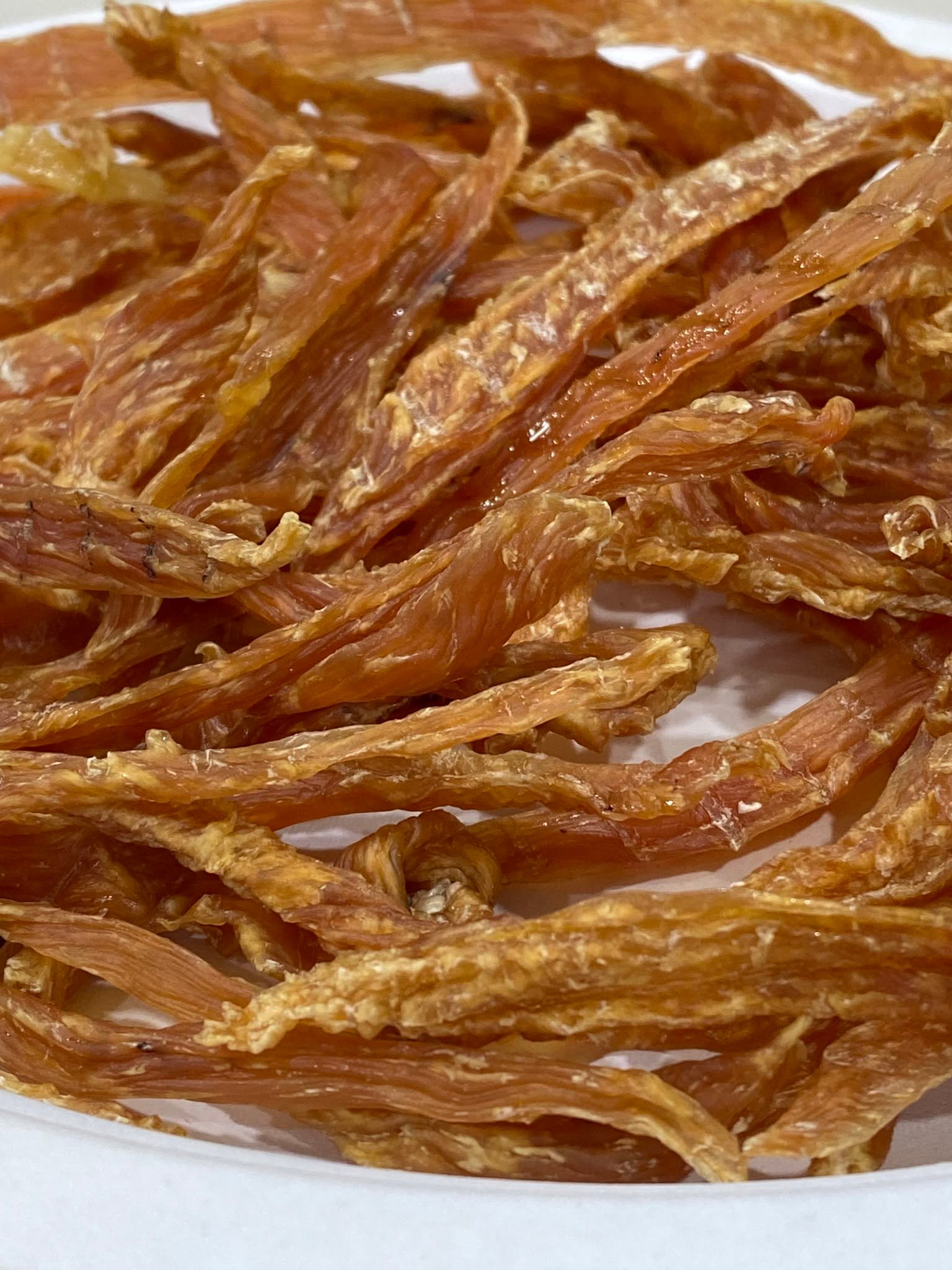 Close view of dried chicken jerky strips