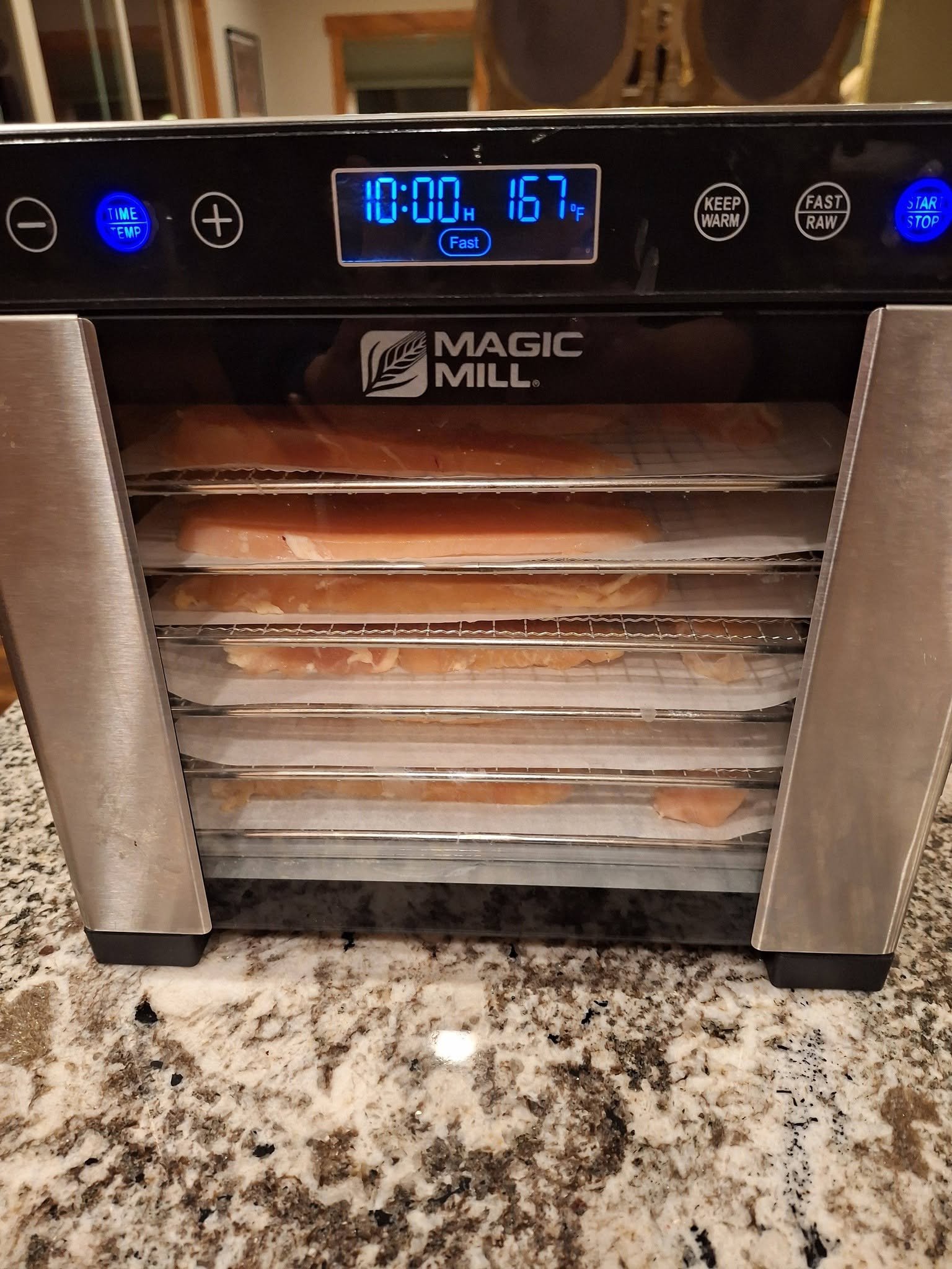 Dehydrator display showing ten hours and 167 degrees Fahrenheit