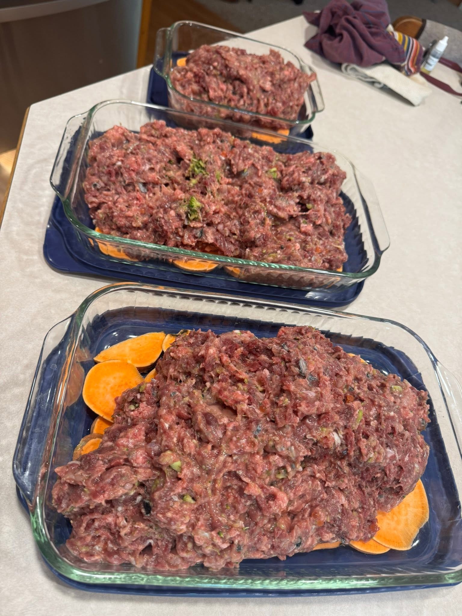 Meat mixture spooned over sliced sweet potato