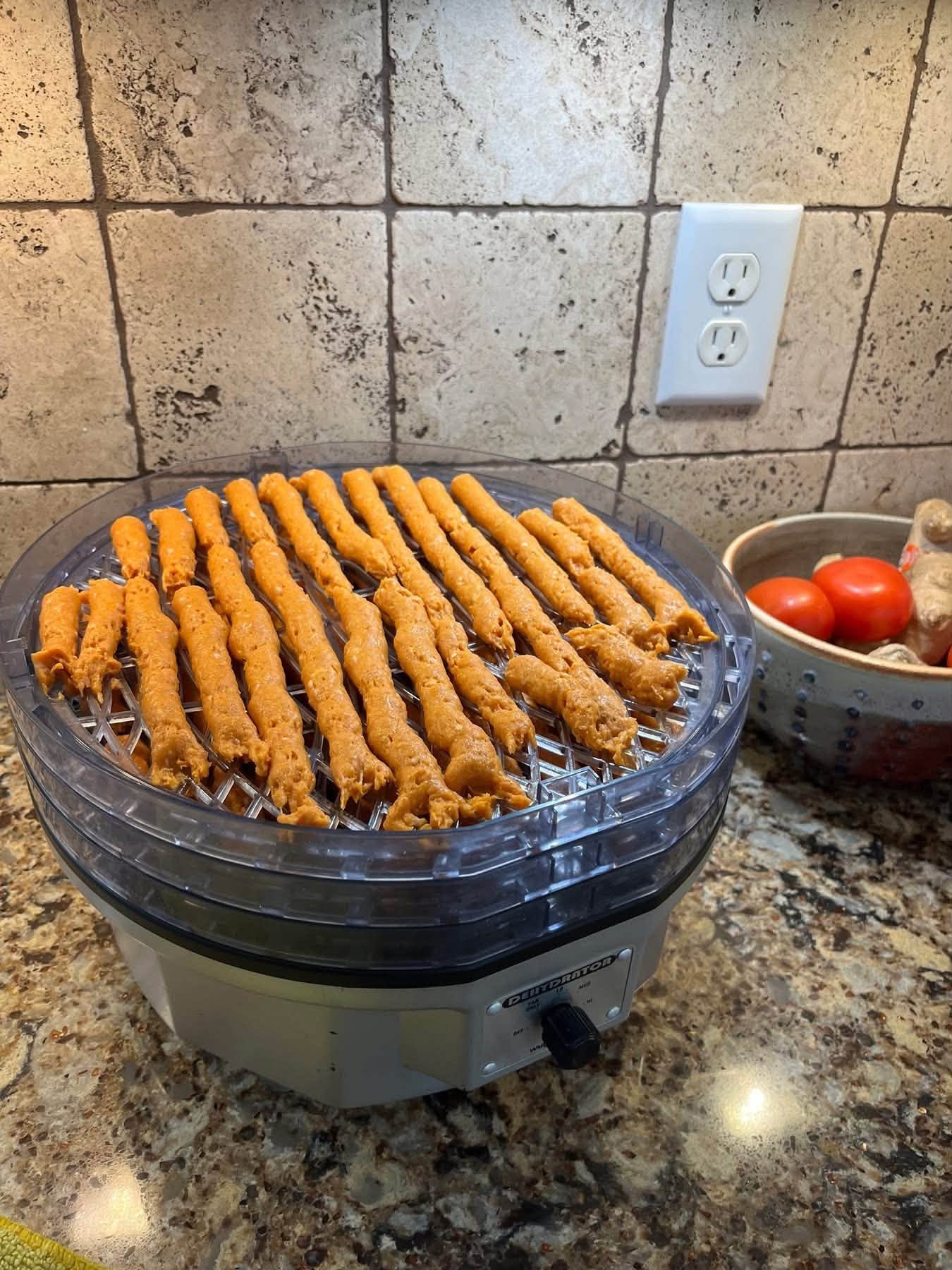 Freshly shaped strips on a round dehydrator tray
