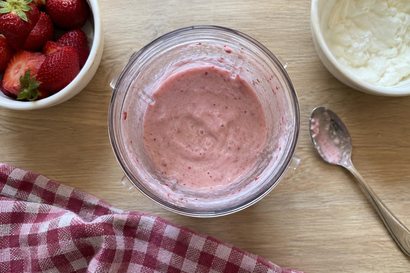 Preparing strawberry yogurt frozen dog treats